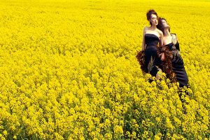 Shot of two models in Irish field of yellow.