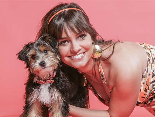 young woman hugging her dog
