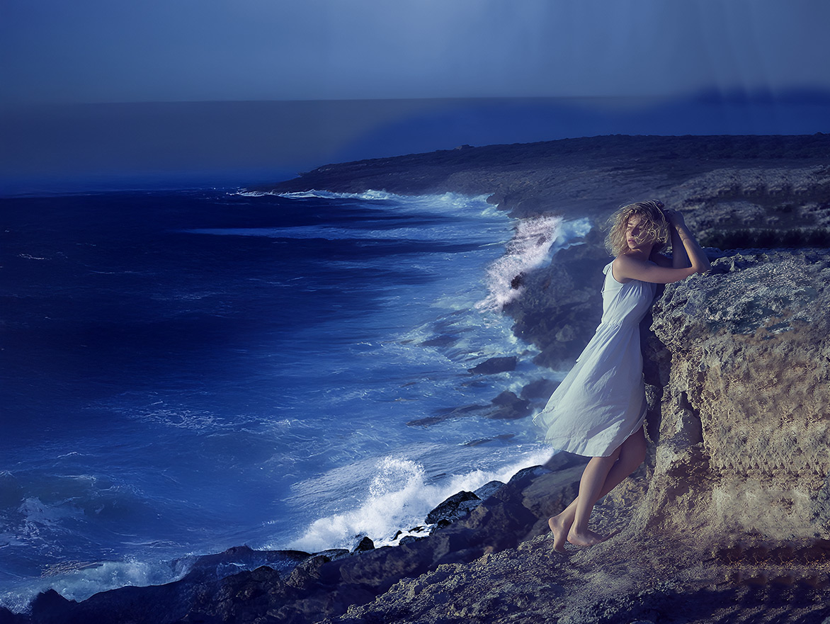 Woman by shore in sea storm